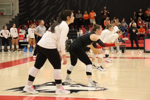 The NIU volleyball team's back line prepares for Bowling Green State University to serve the ball on Friday. The Huskies matched up against Bowling Green again on Saturday, falling in three sets. (Marco Alvarez | Northern Star)