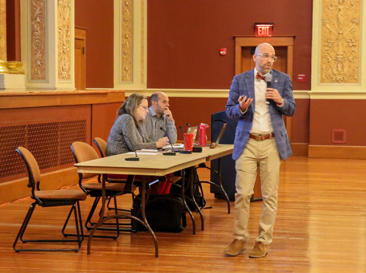 John Acardo, senior associate vice president and chief human resources officer, speaks during the Faculty Senate meeting on Wednesday afternoon in the Altgeld Auditorium. Acardo gave a presentation regarding statistics around reaching goals to help NIU accomplish deficit mitigation strategies. (Marco Alvarez | Northern Star)