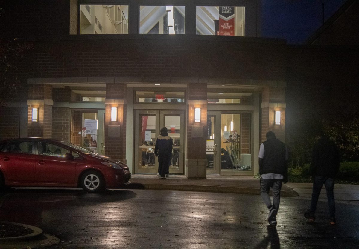 People walk in to the Barsema Alumni and Visitor's Center Tuesday night to vote. The DeKalb County results will be counted until Nov. 18 or 19th (Tim Dodge | Northern Star)