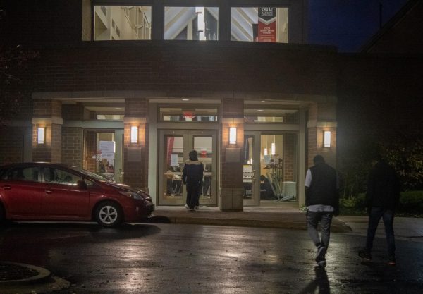 People walk in to the Barsema Alumni and Visitor's Center Tuesday night to vote. The DeKalb County results will be counted until Nov. 18 or 19th (Tim Dodge | Northern Star)