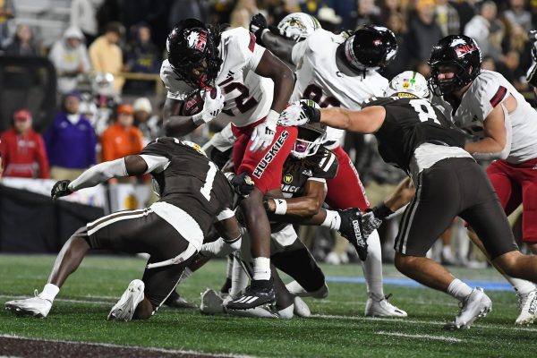 NIU freshman running back Telly Johnson Jr. (22) carries the ball during the third quarter of the Huskies’ 42-28 victory against Western Michigan University on Wednesday night at Waldo Stadium in Kalamazoo, Michigan. Johnson finished with a career-high 141 yards and two touchdowns on 23 carries. (Courtesy of NIU Athletics)