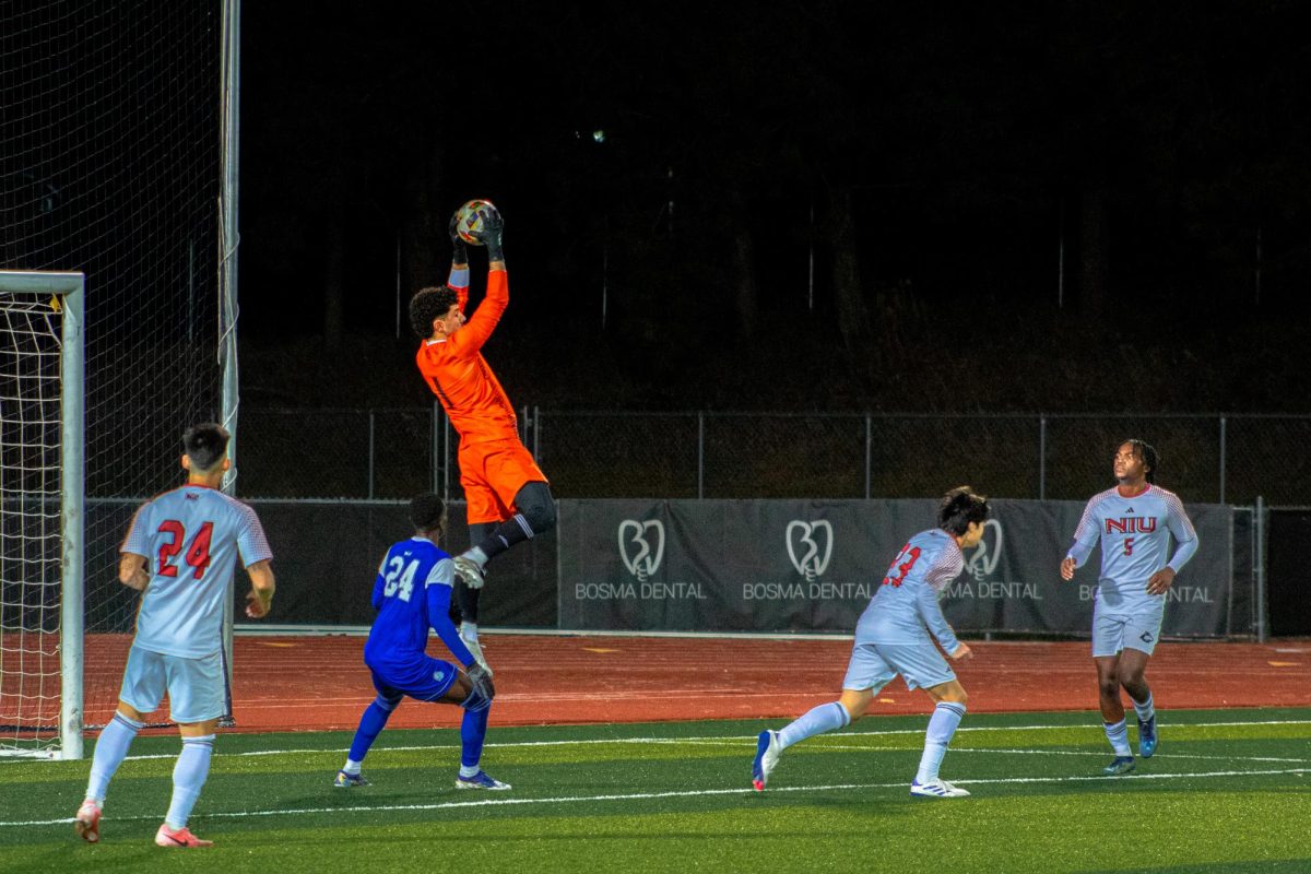 NIU men's soccer sophomore goalkeeper Atahan Arslan (1) catches a corner kick from Drake University on Nov. 1 in NIU's 3-2 loss against Drake. The Huskies finished the 2024 season at the bottom of the Missouri Valley Conference standings, ending with a 1-6-1 record within the MVC. (Totus Tuus Keely | Northern Star)