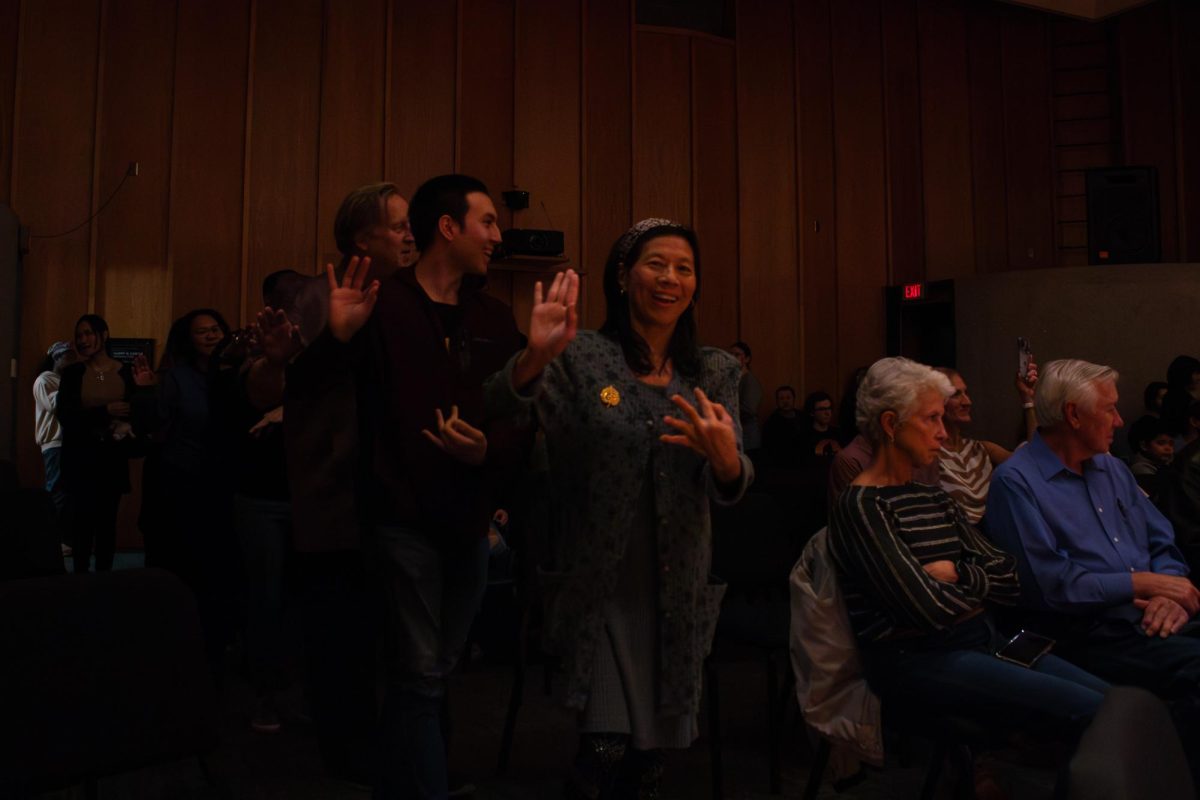 Audience members dance around the center section of seating in the Recital Hall in the Music Building. Audience members were invited to join in a social dance while the Thai Music Ensemble performed “Nok Sai Bin Kham Tung” on Tuesday. (Totus Tuus Keely | Northern Star)