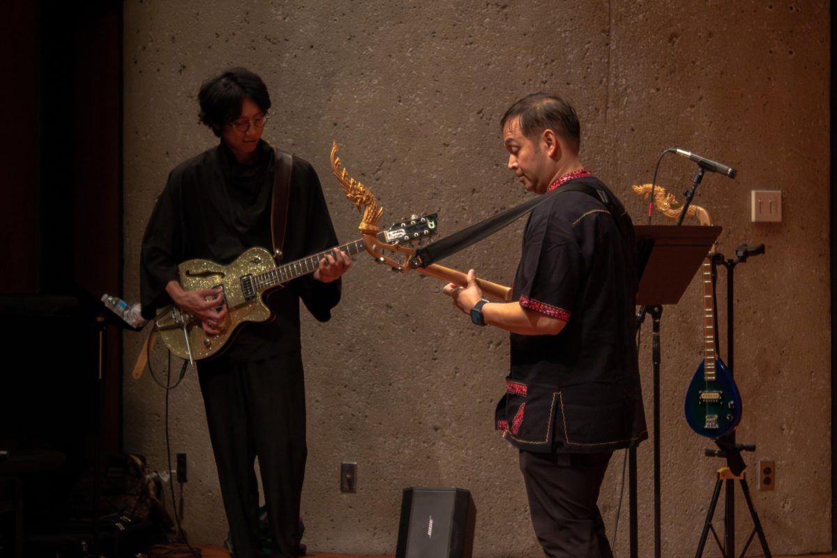  Ajarn Chamni Sriparam and Sathapat Sangsuwan perform “Nok Sai Bin Kham Tung” with an electronic guitar and electronic Pin to an electronic backing track. The Thai Music Ensemble concert began at 5 p.m. in the Recital Hall of the Music Building. (Totus Tuus Keely | Northern Star)