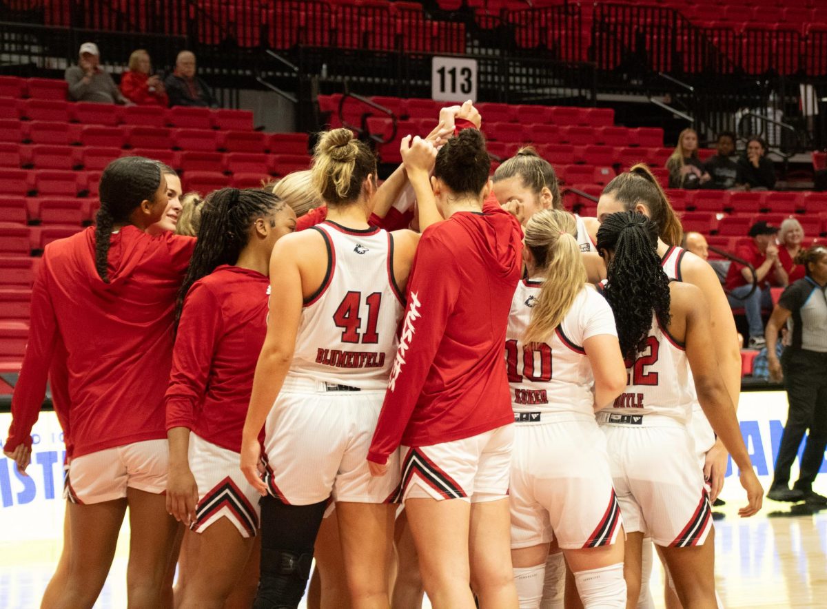 The NIU women's basketball team groups together before its game against the University of Louisiana at Lafayette Ragin' Cajuns on Monday. After traveling to face off against the University of Iowa Hawkeyes on Wednesday, the Huskies fell to the Hawkeyes 91-73. (Northern Star File Photo)