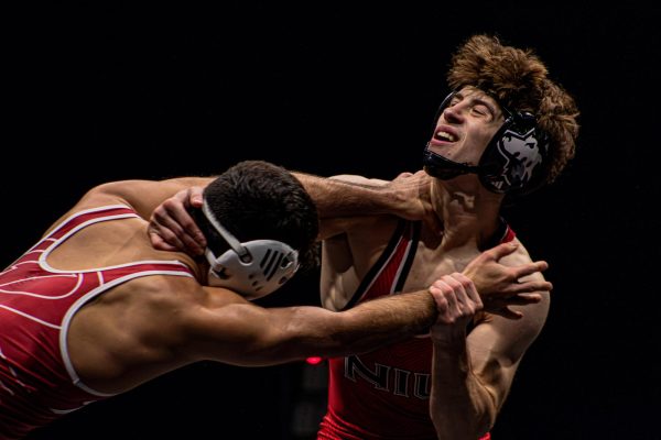  Redshirt junior Blake West fights against Rider University senior Will Betancourt’s grip at the base of his neck. West stopped Betancourt from winning a single point across all three periods. (Totus Tuus Keely | Northern Star)