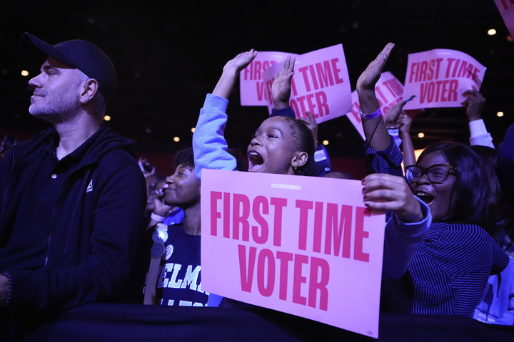 First-time voters hold up signs that clarify their status as first-time voters during an event Oct. 29 in College Park, Georgia. Editor-in-Chief Olivia Zapf recognizes the chaotic rush of information voters have faced this election season, encouraging first-time voters to listen to their own hearts on Tuesday and be unafraid to cast a vote. (AP Photo/Brynn Anderson)