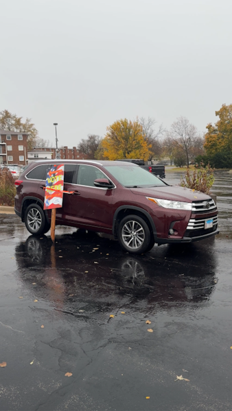 A vehicle is seen in front of the Westminster church with “vote here” signage taped to the side of it. With today being the presidential election, residents are finding resourceful ways to get others to vote. (Ryan Day | Northern Star)