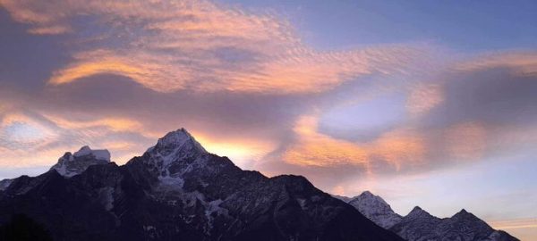 Mt. Thamserku sits under a pink sunset sky east of Khumjung village in Nepal. Opinion Columnist Lalita Rai grew up in Nepal and attends NIU as an international graduate student. (Lalita Rai | Northern Star)