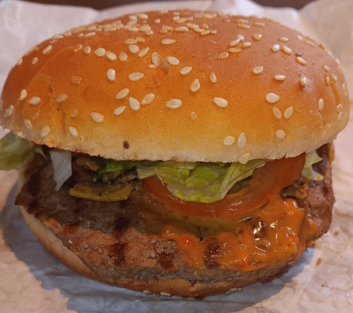 The Mexican Street Corn Whopper sits unwrapped. This limited-time Whopper is part of Burger King’s inaugural Million Dollar Whopper Contest. (Caleb Johnson | Northern Star)