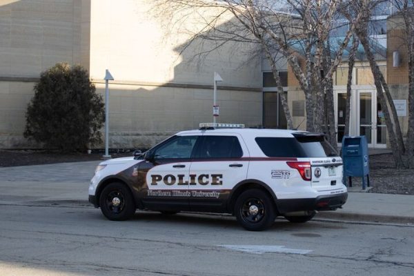 An NIU Police car sits parked on Feb. 26 in front of Barsema Hall. Crimes such as stalking and hazing were reported in November 2024 on NIU's campus. (Northern Star File Photo)