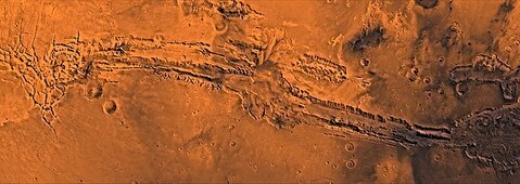 The Valles Marineris canyon system runs along the Martian equator. Opinion Columnist Ethan Ernst believes ambitions to colonize Mars, like Elon Musk’s goals, may be dangerous and far-fetched. (Courtesy of Wikimedia Commons)