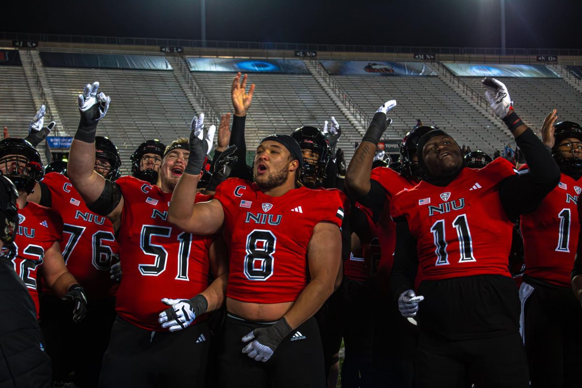 NIU football players celebrate and sing the “Huskie Fight Song” after their 24-16 win against Central Michigan University on Nov. 30. NIU will conclude the 2024 season at the Famous Idaho Potato Bowl on Dec. 23 in Boise, Idaho, facing off Fresno State in a rematch of the 2010 Humanitarian Bowl. (Totus Tuus Keely | Northern Star)