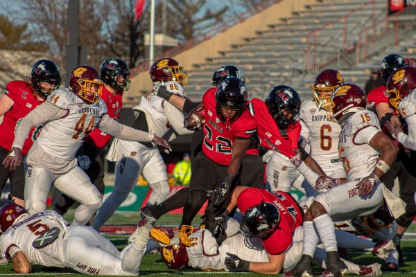  Freshman running back Telly Johnson Jr. (22) attempts to rush the ball up the middle for a one-yard gain. Johnson Jr. averaged 4.2 yards per rush. (Totus Tuus Keely | Northern Star)