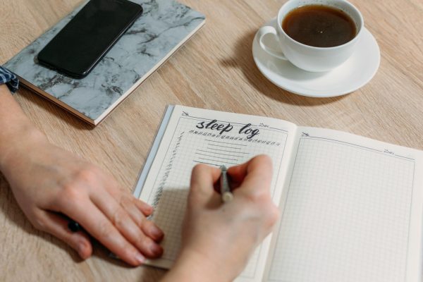 Someone logs a new entry into a bullet journal. Bullet journaling is a good hobby to pick up in the new year. (Getty Images)