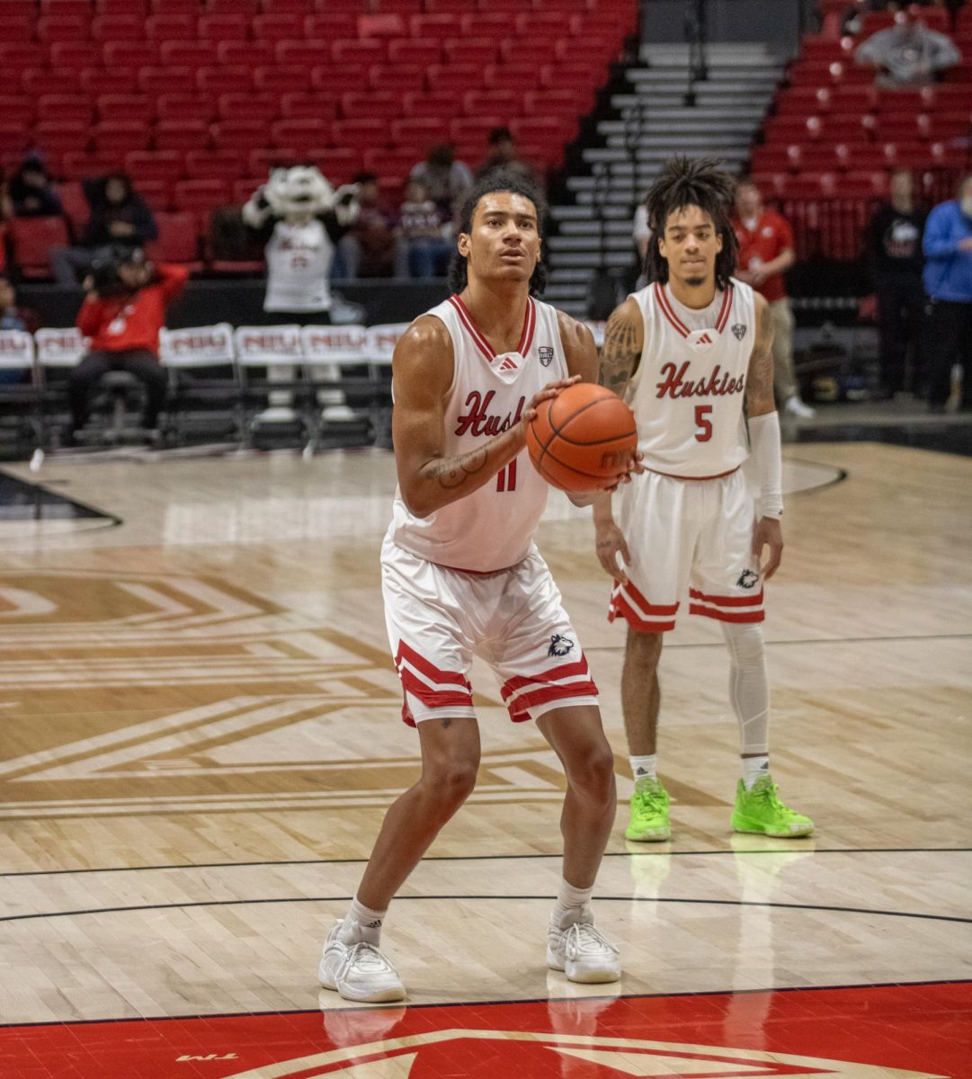 Freshman forward Jayden Mott prepares to shoot a free throw on Tuesday at the Convocation Center. Mott made his second-straight start on Saturday as NIU men's basketball lost 101-57 to the University of Northern Iowa. (Tim Dodge | Northern Star)