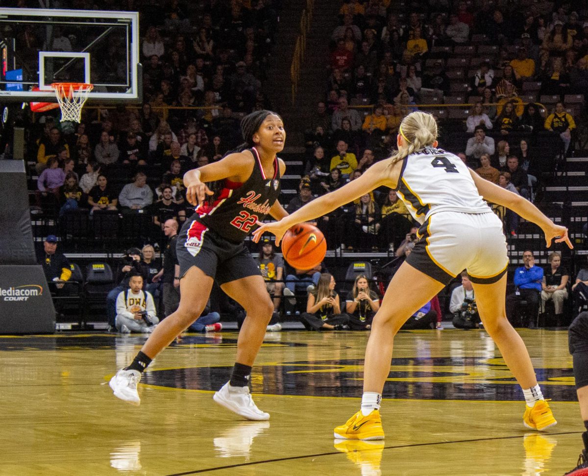 NIU women's basketball junior guard Alecia Doyle eyes the hoop, trying to get past a University of Iowa defender in the Huskies' X-X loss on Nov. 6. The Huskies (Joseph Segreti | Northern Star)