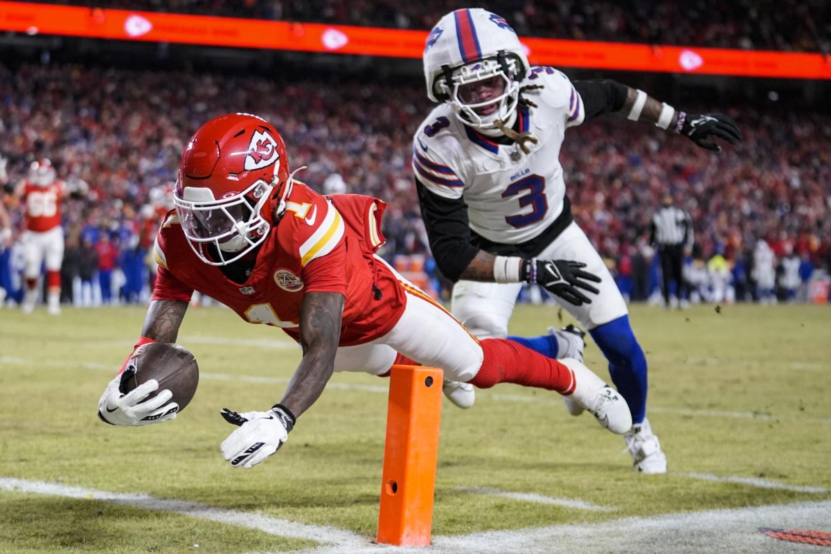 Buffalo Bills safety Damar Hamlin chases down Kansas City Chiefs wide receiver Xavier Worthy as Worthy reaches the endzone in the AFC Championship on Sunday in Kansas City, Missouri. Sports editor Edison Miller discusses why he believes all football players should wear protective covers over their helmet. (Ashley Landis | Associated Press)