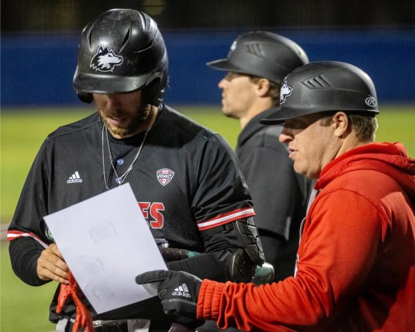 NIU then-junior left fielder CJ Cepicky (39) listens to the third base coach talk game strategy before the top of the eighth inning starts against the University of Illinois Chicago on April 24. NIU baseball released its 2025 season schedule on Dec 18. (Tim Dodge | Northern Star)