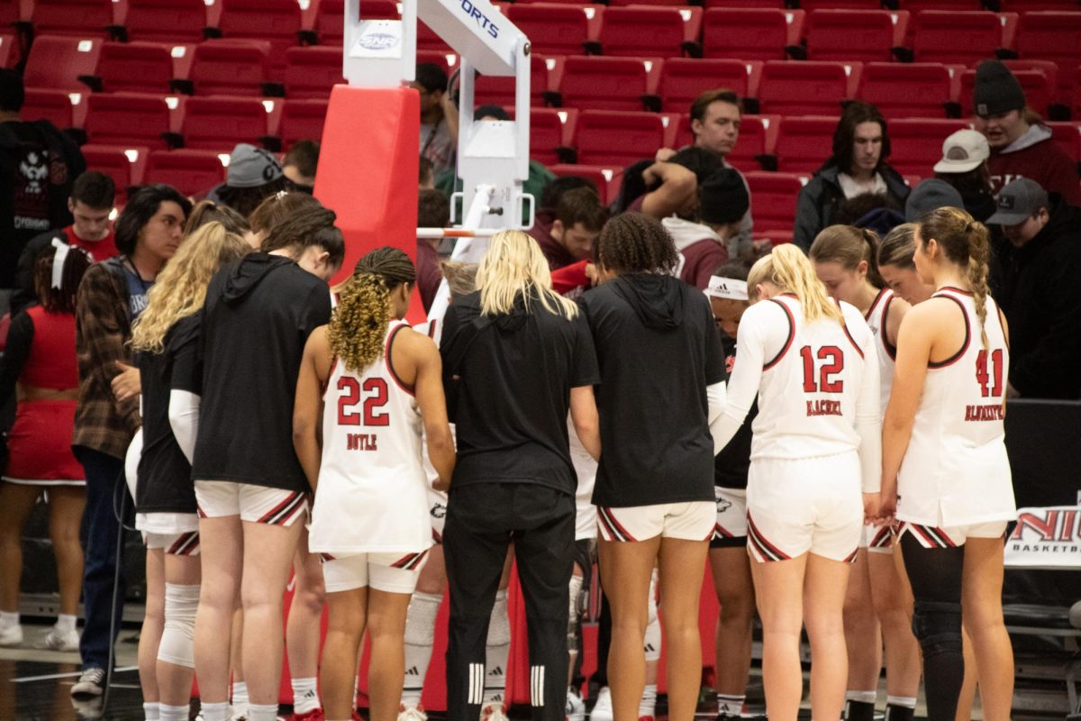 The NIU women’s basketball team huddles together after their win against Central Michigan University. The Huskies led the game for all but seven minutes of the night. (Katie Follmer | Northern Star)