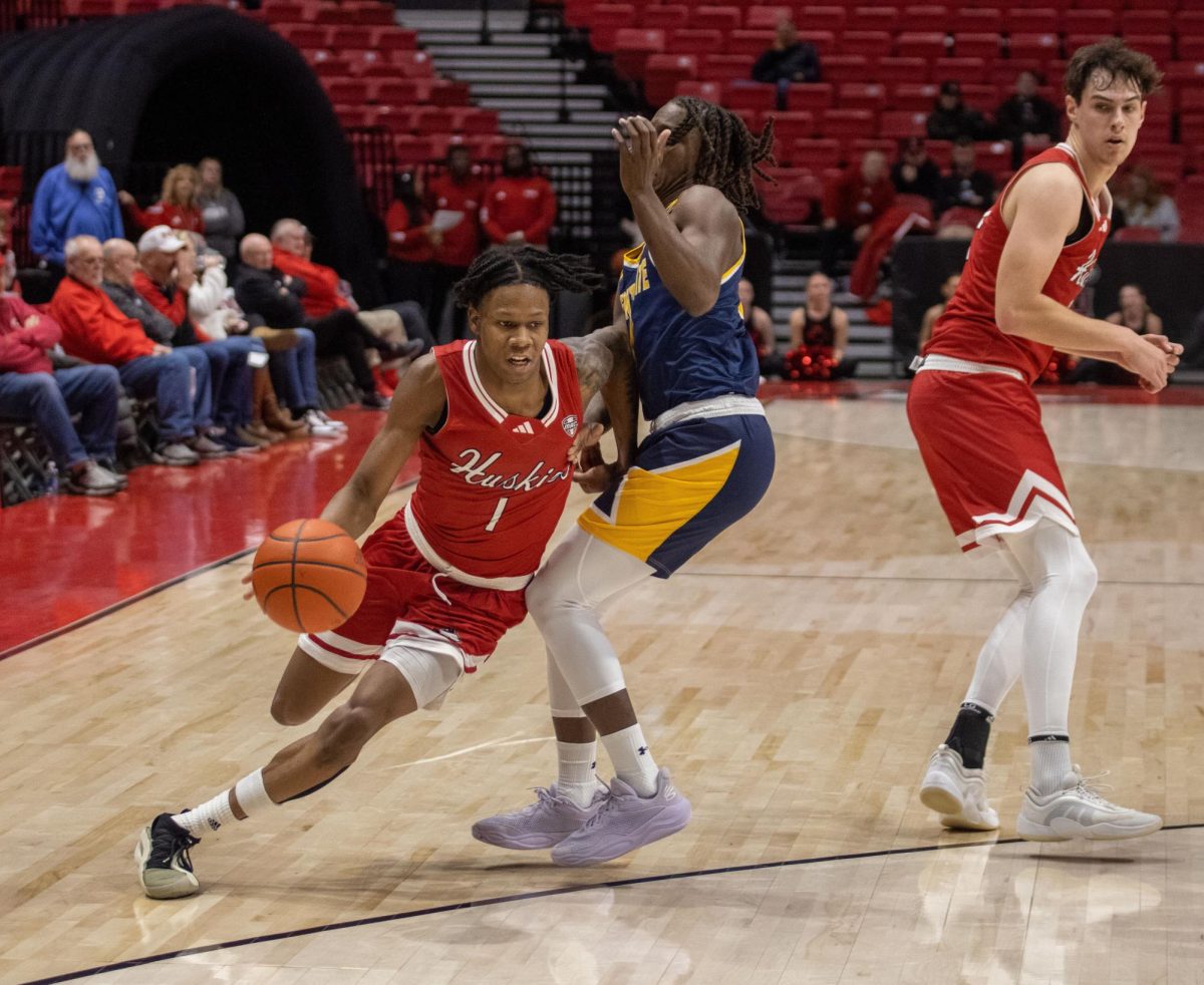 NIU men’s basketball sophomore guard Quentin Jones (1) drives toward the hoop while fending off a Kent State University defender in the Huskies’ 68-50 loss to Kent State on Jan. 7. Jones had 17 points Tuesday in NIU’s 72-70 loss against Western Michigan University in Kalamazoo, Michigan. (Tim Dodge | Northern Star)