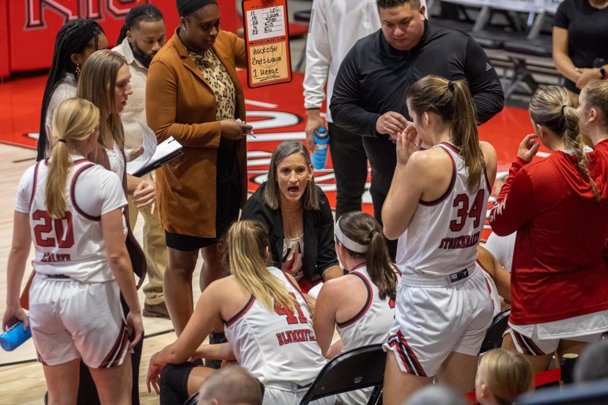 NIU women's basketball head coach Lisa Carlsen speaks to the team during a timeout in it's game against the University of Illinois Chicago on Nov. 27. Sports editor Edison Miller discusses the Huskies' three biggest downfalls this season amid NIU's five-game losing streak. (Tim Dodge | Northern Star)