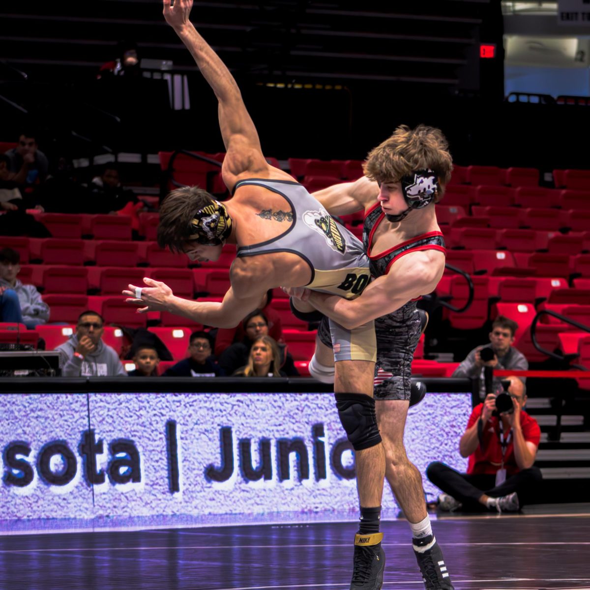 NIU wrestling redshirt junior Blake West picks up Purdue University redshirt senior Matt Ramos and throws him to the mat amid the Huskies’ 29-8 loss against Purdue on Jan. 12. Sports reporter James Bennett breaks down his three biggest takeaways from NIU wrestling’s season so far. (Totus Tuus Keely | Northern Star)