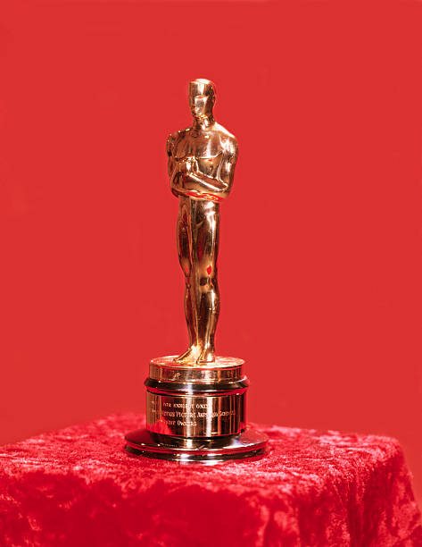 A photo of an Oscar award sitting on a red pedestal on a red background. The 97th Academy Awards has announced the nominees for its 23 categories.(Getty Images/Bettmann)