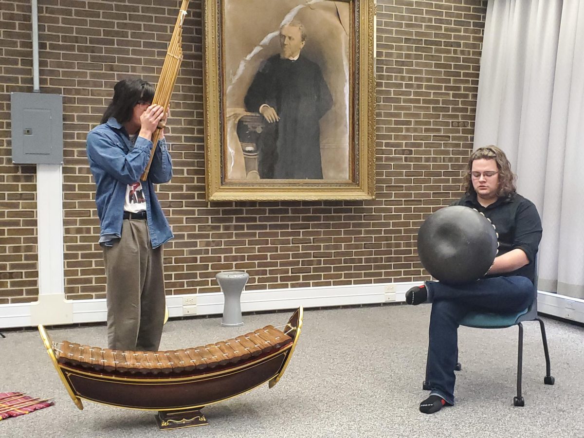 Gabriel Roethle and Ethan Cowburn perform their improvised piece for the audience. The World Music Graduate Program performed "Sounds of Fusion" in the Founders Memorial Library to celebrate the 50-year anniversary of the World Music Program. (Jonathan Shelby | Northern Star)