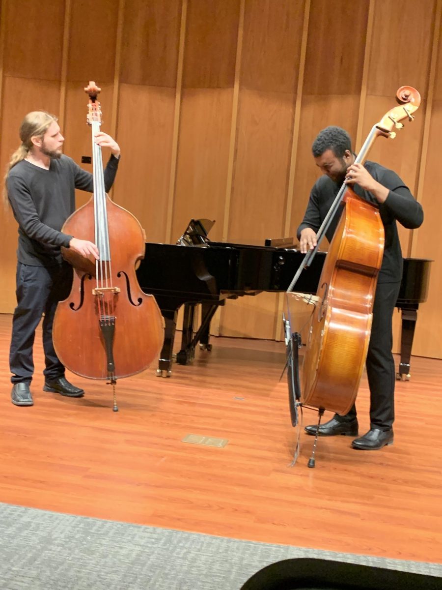 Henry Harris and Jack Sundstrom perform in the Symposium Concert. The NIU School of Music performed several classical songs written by famous composers such as Johann Sebastian Bach and Pyotr Ilych Tchaikovsky. (Ethan Quirk | Northern Star)