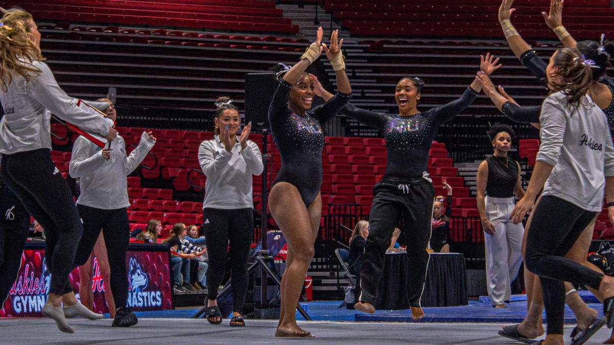 NIU gymnastics sophomore Mikayla Brown is congratulated by the NIU Gymnastics team after her floor routine in the Huskies home meet against Illinois State University on Jan. 24. The Huskies competed in the Western Michigan University Tri-Meet on Sunday, falling to Western Michigan while overtaking the University of Wisconsin-Whitewater. (Totus Tuus Keely | Northern Star)