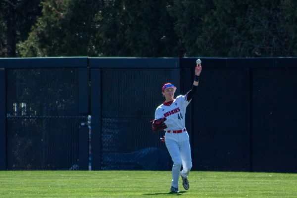 NIU baseball then-freshman right fielder Charlie Parcell (44) throws the ball to the infield during the sixth inning against Kent State University on April 19. The Huskies dropped their first conference game in a 15-5 loss to Kent State on Friday. (Totus Tuus Keely | Northern Star)