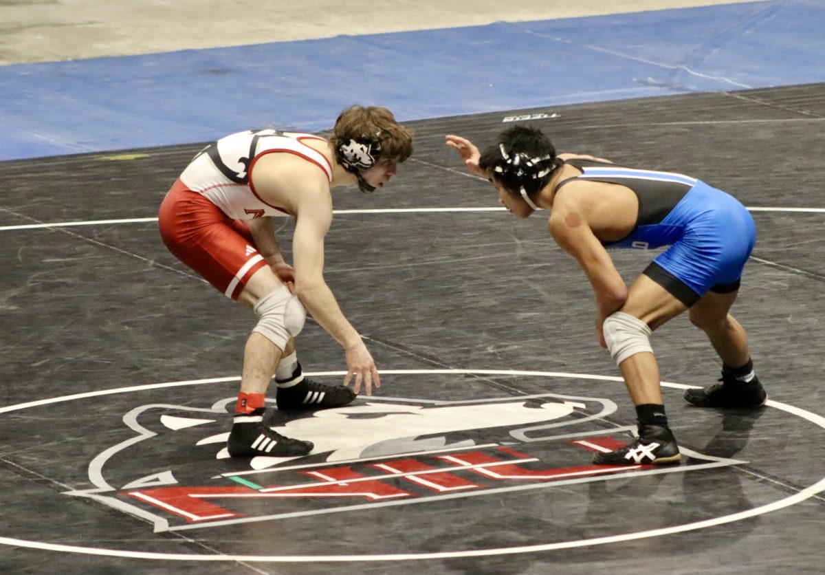 NIU wrestling redshirt junior Blake West faces off with University at Buffalo sophomore Max Elton during the Beauty and the Beast meet on Feb. 7. West became the Mid-American Conference 125 pound champion during the MAC Championships on Saturday. (Marco Alvarez | Northern Star) 