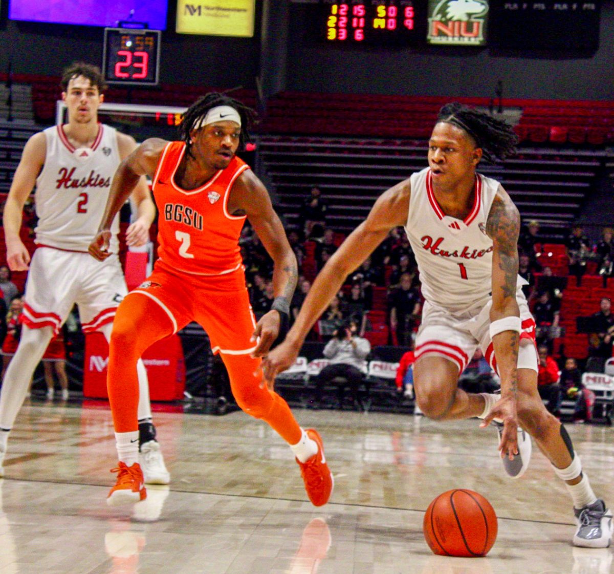 NIU men's basketball sophomore guard Quentin Jones (1) dribbles the basketball past Bowling Green junior guard Javontae Campbell (2).
NIU sparked an 11-game losing streak after falling to Bowling Green State University on Tuesday. (Marco Alvarez | Northern Star)