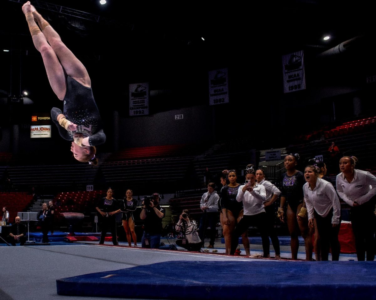NIU gymnastics junior Samantha Nickle flips into the corner during her floor routine against Illinois State University on Jan. 24. The Huskies fell to the Ball State University Cardinals in a head-to-head matchup by a score of 196.900-193.975 on Sunday. (Totus Tuus Keely | Northern Star)