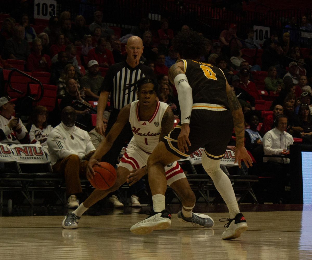 NIU men's basketball sophomore guard Quentin Jones prepares to cross over a Western Michigan in the Huskies' 74-70 loss against WMU on March 1. NIU snapped an 11-game losing skid Friday, overcoming Central Michigan University by a score of 83-81 in double overtime. (Erin Marie Barker | Northern Star)