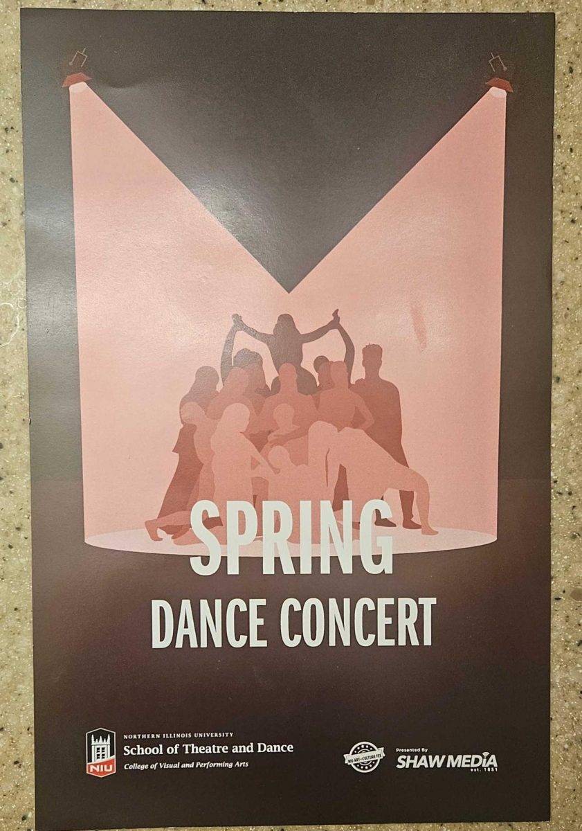 A photo of the Spring Dance Concert flyer sits on a table. The NIU School of Theatre and Dance impressed the audience during its Spring Dance Concert Friday evening. (Kahlil Kambui | Northern Star) 