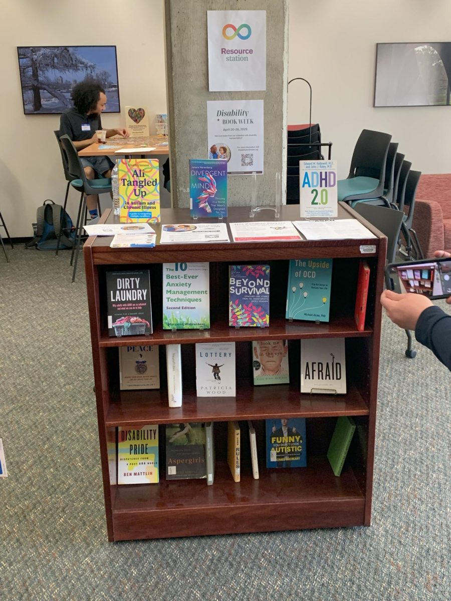 A line of books rest on a shelf in the Staff Lounge. "Empowering Minds of All Kinds" highlighted different aspects of neurodiversity and invited the community to share their perspectives. (Ethan Quirk | Northern Star)