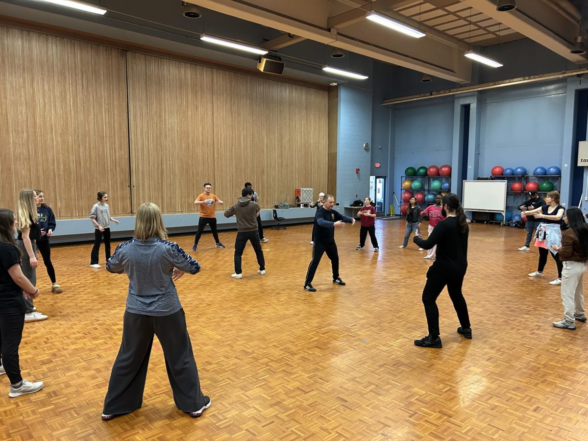 A class practices Tai Chi in Anderson Hall. On April 26, the class will share the traditions of Tai Chi with the NIU community for world Tai Chi day. (Courtesy of Paul Wright)