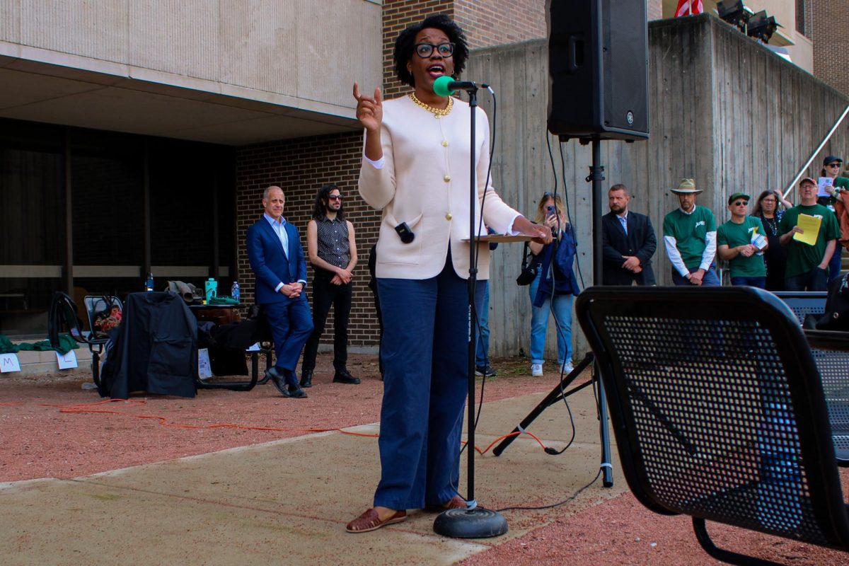 Rep. Lauren Underwood speaks to a crowd of protesters at NIU's MLK Commons. Hundreds of protesters gathered in support of international students, faculty and staff following the revocation of international student visas at NIU and across the country.