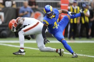 Cleveland Browns tight end Harold Fannin Jr. (88) makes a touchdown catch past Los Angeles Rams safety Nate Valcarcel (43) during the first half of an NFL preseason football game, Saturday, Aug. 23, 2025, in Cleveland. (AP Photo/Sue Ogrocki)