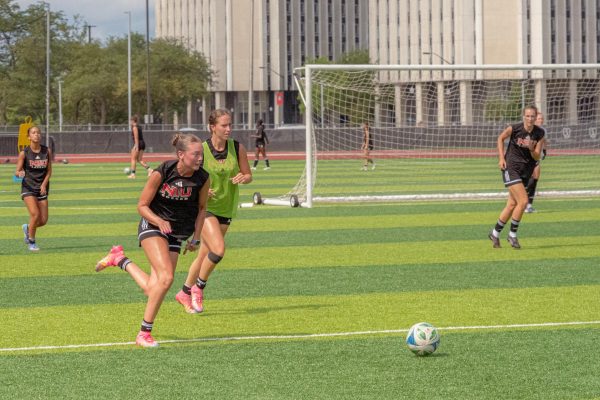 Members of the NIU women's soccer team run downfield after the ball during their practice scrimmage match on Aug. 12 at the NIU Soccer and Track & Field Complex. NIU fell to the University of Minnesota Gophers on Sunday, dropping to 1-2-1 on the season. (Totus Tuus Keely | Northern Star)