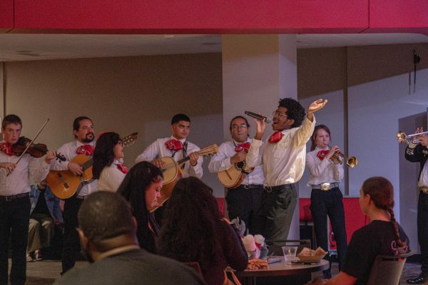 The NIU Mariachi band performs on Saturday in Club 1895 for Welcome Holmes. NIU Mariachi moved from room to room during Welcome Holmes after each quick performance. (Totus Tuus Keely | Northern Star)