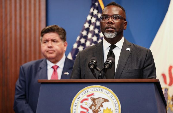 Chicago Mayor Brandon Johnson, in front of Illinois Governor JB Pritzker, speaks during a press conference on reports of federal deployments in Chicago. Opinion Columnist Gabe Santos believes that President Donald Trump deploying federal troops in U.S. cities is the behavior of a dictator. (REUTERS | Jim Vondruska)