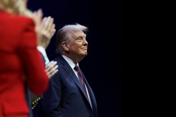 A photo depicts President Donald Trump at an event on Monday at the Museum of the Bible to deliver remarks to the White House Religious Liberty Commission. Opinion Columnist Lucy Atkinson argues that guns should be banned for everyone, not just transgender people. (Reuters | Evelyn Hockstein)