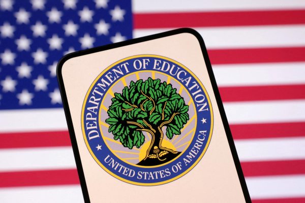 The United States Department of Education logo and U.S. flag are pictured in an illustration. Opinion Columnist Byrdie Seda believes the Trump administration's dismantling of the Department of Education will bring more harm to education than good. (REUTERS | Dado Ruvic)