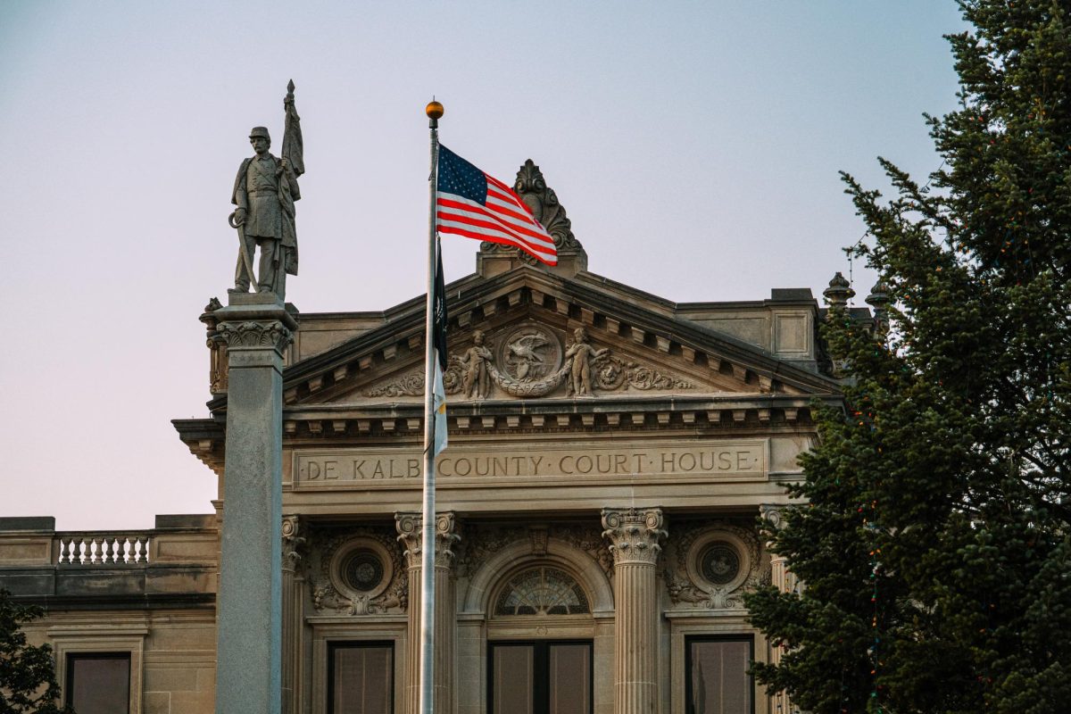 An American flag waves on top of a pole on Aug. 19 in front of the DeKalb County Courthouse. A man was sentenced to 14 years in prison for the murder of DeKalb County Sheriff’s Deputy Christina Musil last Tuesday. (Totus Tuus Keely | Northern Star)