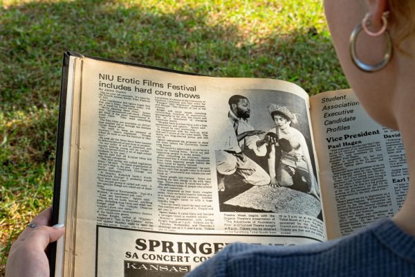 A Northern Star collection of 1976 newspapers from April 16 to Aug. 12 is open to a headline reading “NIU Erotic Films Festival includes hard core shows.” The Northern Star digitization project, an effort to convert print issues from 1899 to 1997 to a digital format, has been delayed again. (Totus Tuus Keely | Northern Star)