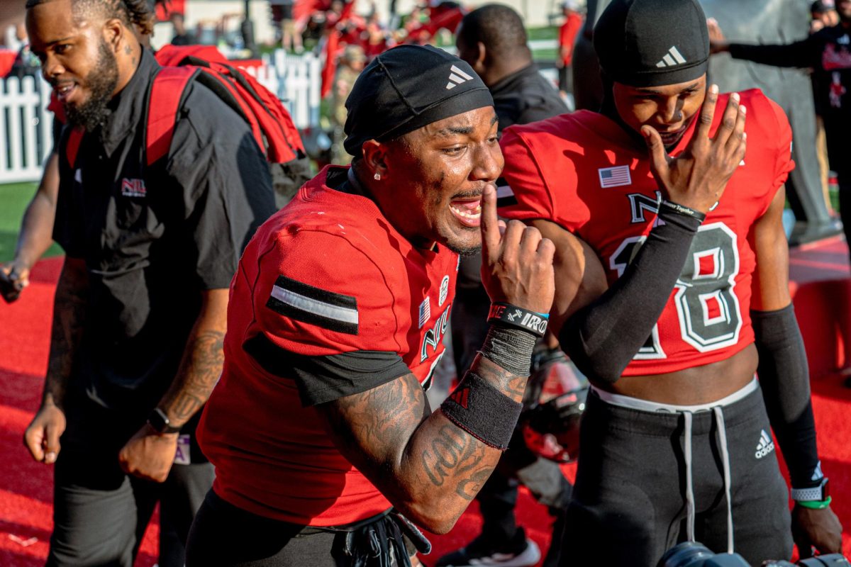 NIU football junior wide receiver DeAree Rogers (6) says “We ain’t losing at home all season” to a camera recording their exit to Yordon Center following their win on Saturday against the College of the Holy Cross. The Northern Star Sports staff shares their predictions for the outcomes of five college football games scheduled to take place this weekend.  (Totus Tuus Keely | Northern Star)