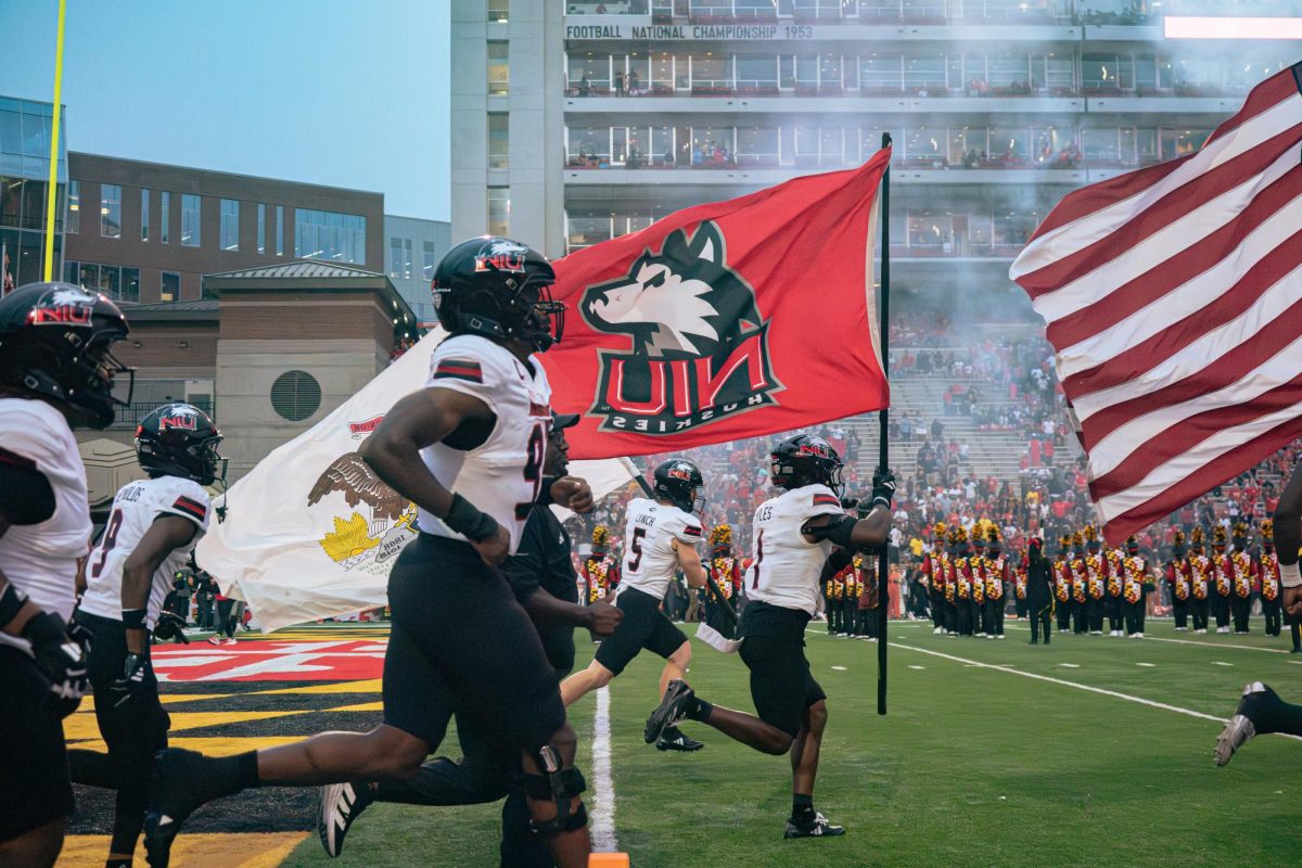 The NIU football team runs onto the field before the Huskies’ matchup against the University of Maryland on Sept. 5 at SECU Stadium in College Park, Maryland. NIU fell to Mississippi State University 38-10 on Saturday. (Totus Tuus Keely | Northern Star)